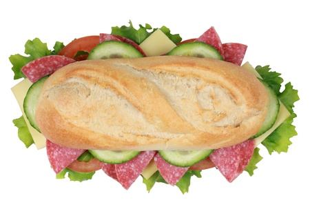 Top view of a sandwich with pepperoni, cheese, tomatoes, lettuce and cucumberの写真素材
