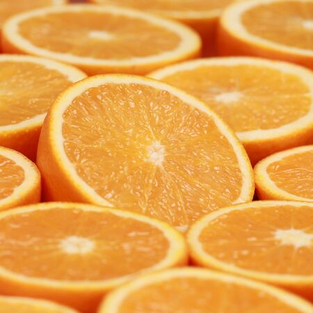 Collection of sliced oranges forming a backgroundの写真素材