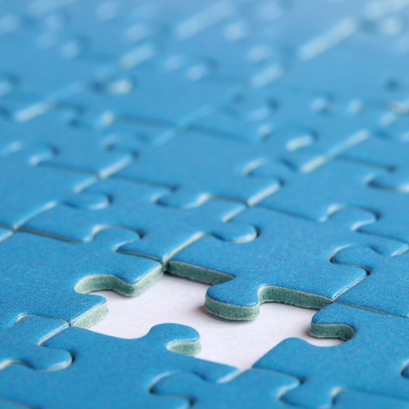 Jigsaw Puzzle with the missing piece, shallow depth of fieldの写真素材