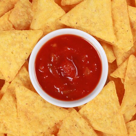 Collection of Mexican Tortilla chips served with a salsa sauceの写真素材