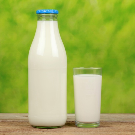 Organic milk in a bottle and in a glassの写真素材