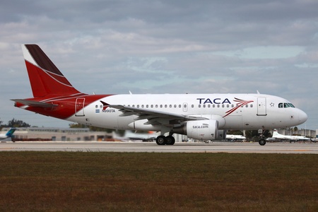 Miami, Florida - March 17, 2013: A TACA Airbus A319 with the registration N990TA taxis at Miami International Airport (MIA) in Florida. TACA International Airlines are headquartered in El Salvador. They operate with 50 planes and carry 3.5 million passengのeditorial素材