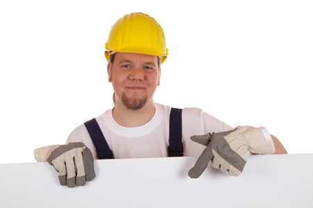 Construction worker showing on a white sign, isolated on white