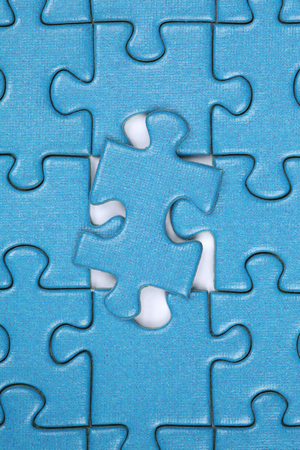 Last piece in a jigsaw puzzle, concept problem solution and strategyの写真素材