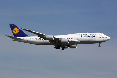 Frankfurt, Germany - June 19, 2013: A Lufthansa Boeing 747-8 with the registration D-ABYH on approach to Frankfurt Airport (FRA). Lufthansa is the German flag carrier and Europe's largest airline with some 665 planes and 103 million passengers in 2012. Frのeditorial素材