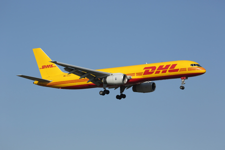 Lisbon, Portugal - July 20, 2013: A DHL Boeing 757-200PF with the registration D-ALEJ on approach to Lisbon Airport (LIS) in Portugal. DHL is Europe's largest cargo only airline and owned by Deutsche Post. It operates with 133 aircraft.のeditorial素材