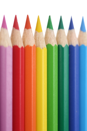 Colored pencils in a row, isolated on a white backgroundの写真素材