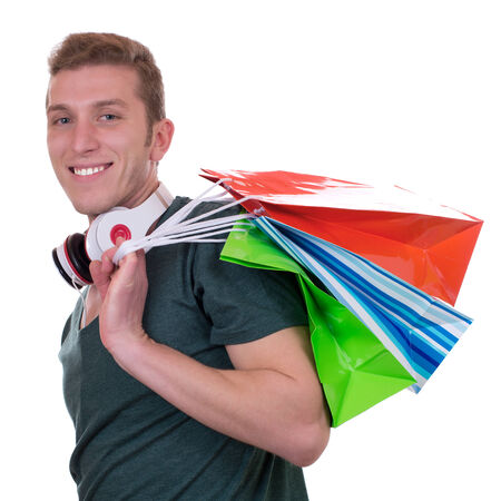Casual man with headphones and shopping bags, isolated on a white backgroundの写真素材