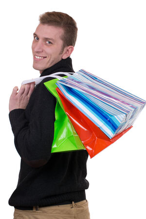 Young man with shopping bags, isolated on a white backgroundの写真素材