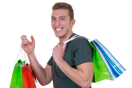 Young man with shopping bags, isolated on a white backgroundの写真素材