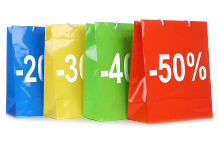 Shopping bags with discounts during sale, isolated on a white backgroundの写真素材