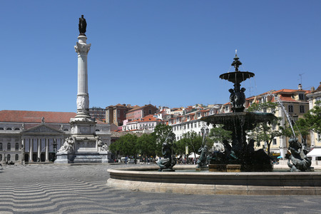 Rossio square in Lisbon Portugal with a statue and a fountainのeditorial素材