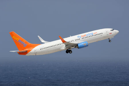 Curacao - February 16, 2014: A Sunwing Airlines Boeing 737-800 with the registration C-FYLC taking...