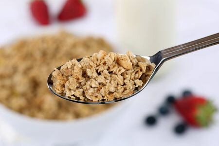 Healthy cereals on a spoon for breakfastの写真素材