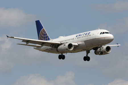 Miami, Florida - April 10, 2014: A United Airlines Airbus A319 with the registration N805UA on approach to Miami Airport (MIA) in Florida. United Airlines is the world's largest airline with 695 planes and some 92 million passengers in 2012. It is headquaのeditorial素材