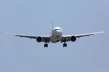 An airplane on approach shortly before landing during a journeyの写真素材
