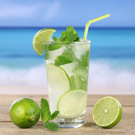 Mojito or Caipirinha cocktail drink on the beach while on vacationの写真素材