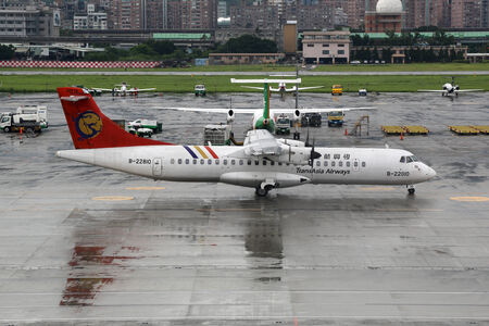Taipei, Taiwan - May 18, 2014: A TransAsia Airways ATR 72-200 with the registration B-22810 taxis at Taipei Songshan Airport (TSA) in Taiwan. This aircraft crashed on July 23, 2014 in Magong / Makung on Penghu Island in Taiwan.のeditorial素材