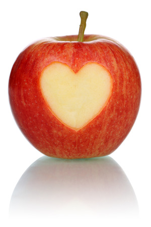 Apple with heart love topic, isolated on a white backgroundの写真素材