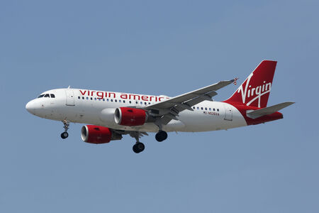 Los Angeles, California - April 19, 2014: A Virgin America Airbus A319 with the registration N526VA on approach to Los Angeles International Airport (LAX). Virgin America is a US-American low-cost airline with its headquarters near San Francisco.のeditorial素材