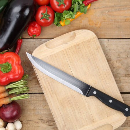 slicing food and vegetables knife on cutting boardの写真素材