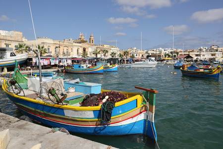Boats and market in Marsaxlokk harbor on Malta islandのeditorial素材