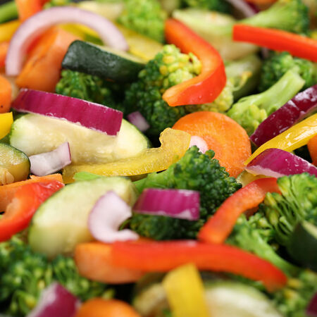 Healthy eating preparing and cooking food vegetables background in panの写真素材
