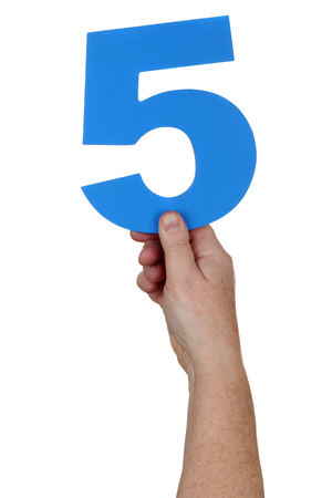 Hand holding number 5 isolated on a white backgroundの写真素材