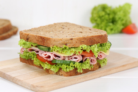 Sandwich toast bread for breakfast with ham, cheese, tomatoes, lettuce