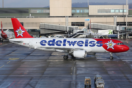 Zurich, Switzerland - January 23, 2016: An Edelweiss Air Airbus A320 with the registration HB-IJW taxis at Zurich Airport (ZRH) in Switzerland. Edelweiss Air is an airline from Switzerland with its headquarters in Zurich. It is owned by Swiss Internationaのeditorial素材