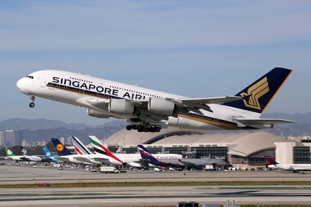 Los Angeles, USA - February 22, 2016: A Singapore Airlines Airbus A380 with the registration 9V-SKS taking off at Los Angeles International Airport (LAX) in the USA. The Airbus A380 is the world's largest passenger airliner. Singapore Airlines is the flagのeditorial素材