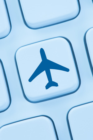 Booking flight holidays vacation online shopping e-commerce internet travel shop web keyboardの写真素材