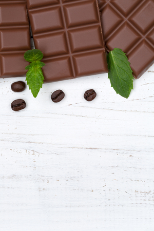 Milk chocolate chocolates bar food wooden board portrait format copyspace top view from aboveの写真素材