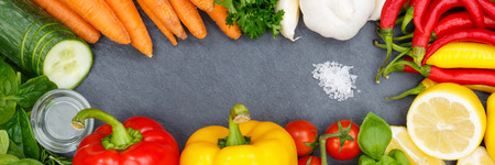 Vegetables collection tomatoes carrots cooking ingredients banner slate bell pepper background top view from aboveの写真素材