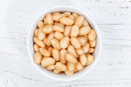 White beans from above bowl wooden board wood
