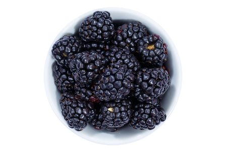 Blackberries berries from above bowl isolated on a white background