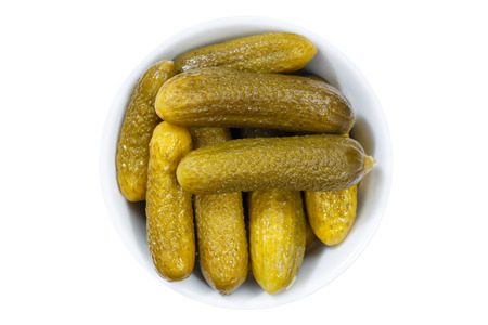 Small gherkins cucumber vegetable vegetables from above bowl isolated on a white backgroundの写真素材