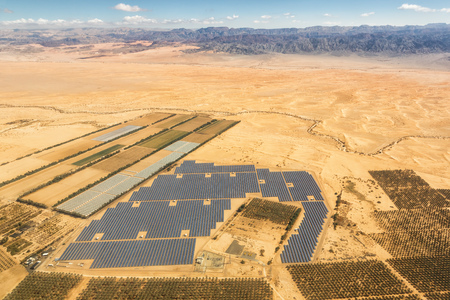 Solar panels farm energy panel Israel desert mountains from above aerial view landscape