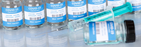 Coronavirus Vaccine bottle Corona Virus syringe COVID-19 Covid vaccines panoramic view bottlesの写真素材