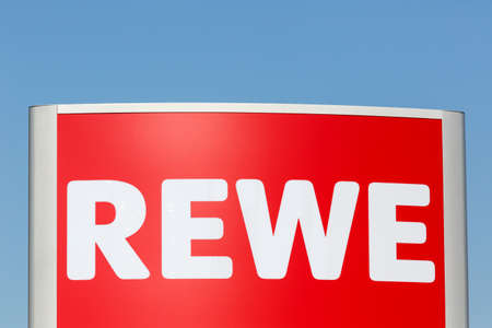 Stuttgart, Germany - May 17, 2020: REWE logo sign supermarket food shop discounter in Germany.のeditorial素材