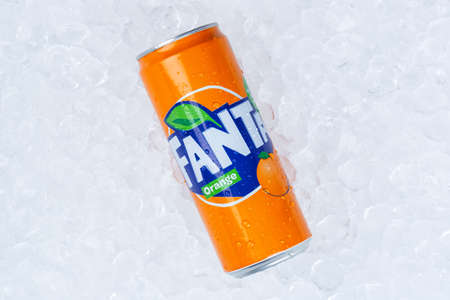 Stuttgart, Germany - January 17, 2021: Fanta orange lemonade soft drink in can ice cubes in Stuttgart in Germany.のeditorial素材