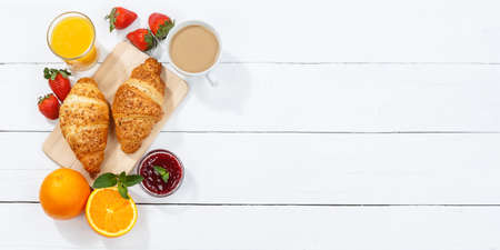 Croissant breakfast croissants orange juice coffee food wooden board from above copyspace copy space...