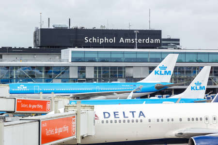 Amsterdam, Netherlands - May 21, 2021: Airplanes at Amsterdam Schiphol airport (AMS) in the...