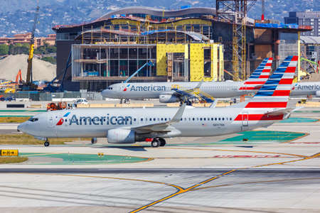 Los Angeles, California - April 12, 2019: American Airlines Boeing and Airbus airplanes at Los Angeles Airport (LAX) in the United States.のeditorial素材