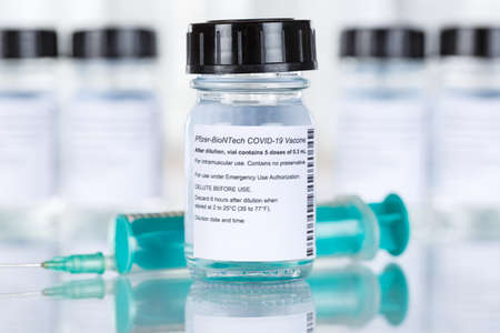 Stuttgart, Germany - March 19, 2021: Biontech Pfizer Coronavirus Vaccine Corona Virus COVID-19 Covid syringe vaccines copyspace copy space in Germany.のeditorial素材