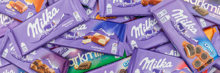 Stuttgart, Germany - March 3, 2021: Milka chocolate chocolates different types variety background banner in Germany.のeditorial素材