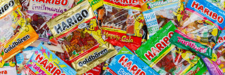 Stuttgart, Germany - March 7, 2021: Haribo gummy bear gummi candy candies different types variety background banner in Stuttgart, Germany.のeditorial素材