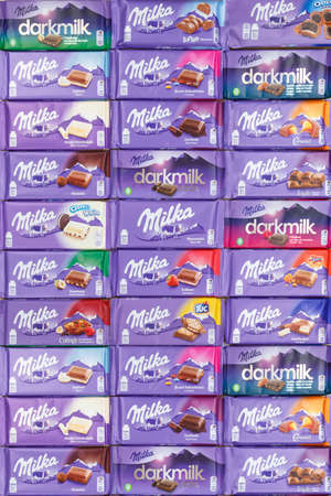Stuttgart, Germany - March 3, 2021: Milka chocolate chocolates different types variety background portrait format in Germany.のeditorial素材