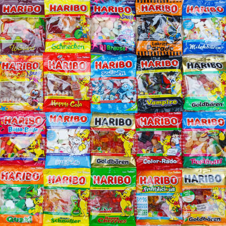 Stuttgart, Germany - March 7, 2021: Haribo gummy bear gummi candy candies different types variety background square in Stuttgart, Germany.のeditorial素材