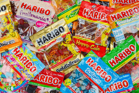 Stuttgart, Germany - March 7, 2021: Haribo gummy bear gummi candy candies different types variety background in Stuttgart, Germany.のeditorial素材